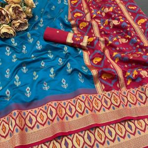 Evocative Firozi Banarasi Ikkat Silk Saree With Staggering Blouse Piece