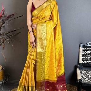 Pleasant Yellow Banarasi Tissue Silk Saree With Tantalizing Blouse Piece