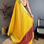 Pleasant Yellow Banarasi Tissue Silk Saree With Tantalizing Blouse Piece