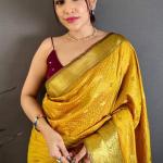 Pleasant Yellow Banarasi Tissue Silk Saree With Tantalizing Blouse Piece