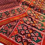 Ornate Maroon Patola Lagdi Patta Saree With Arresting Blouse Piece