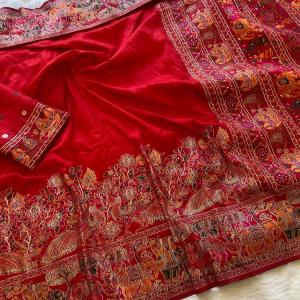 Tempting Red Pashmina Saree With Elaborate Blouse Piece