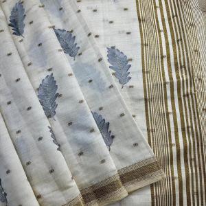 Whimsical Off White Embroidery Work Tussar Silk Saree With Blissful Blouse Piece