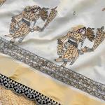 Snazzy Off White Kalamkari Thread Work Tussar Silk Saree With Opulent Blouse Piece