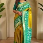 Flaunt Mustard Soft Banarasi Silk Saree With Inimitable Blouse Piece